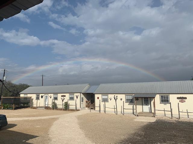 A rainbow over Fulfillment and Production, God's promise to us found in Genesis.