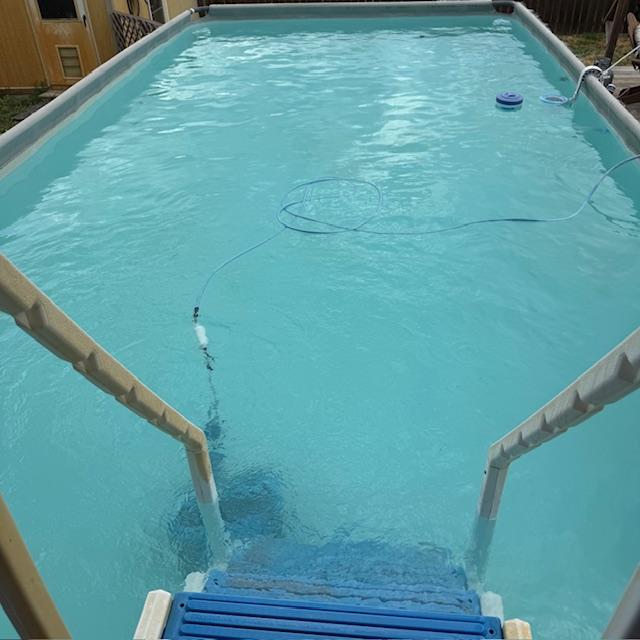 I was almost finished cleaning the pool and about to swim my first lap when the thunder started. Then the drops began and I got out.