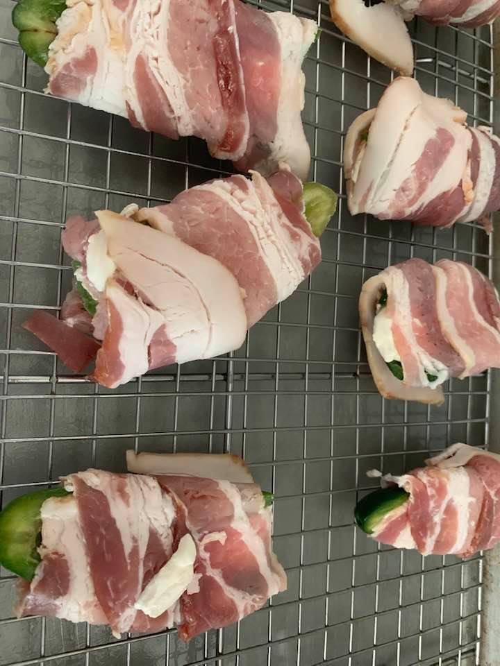 The bacon-wrapped jalapeno poppers are now ready to go into the oven. Prepare to be blown away by the delicious aroma coming out of your oven!