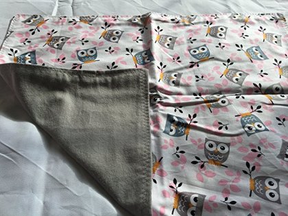 A blanket I sewed with cotton and flannel. I used a zigzag stitch for the top stitching.