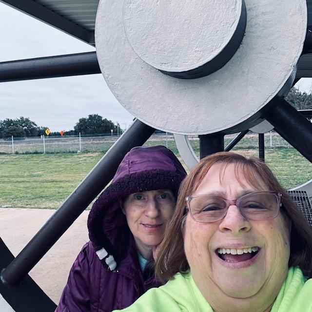 Norma and me today at a rest stop with wagon wheels. She thought it would be a good photo.