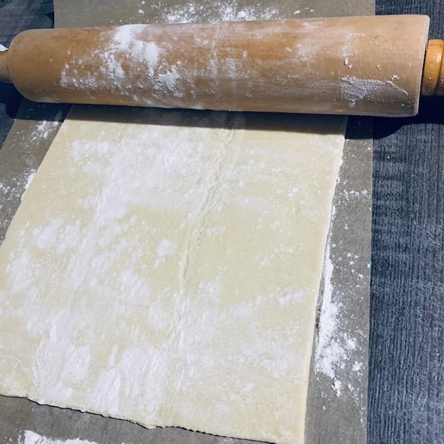 Roll out the puff pastry until it is big enough to completely cover the meat.
