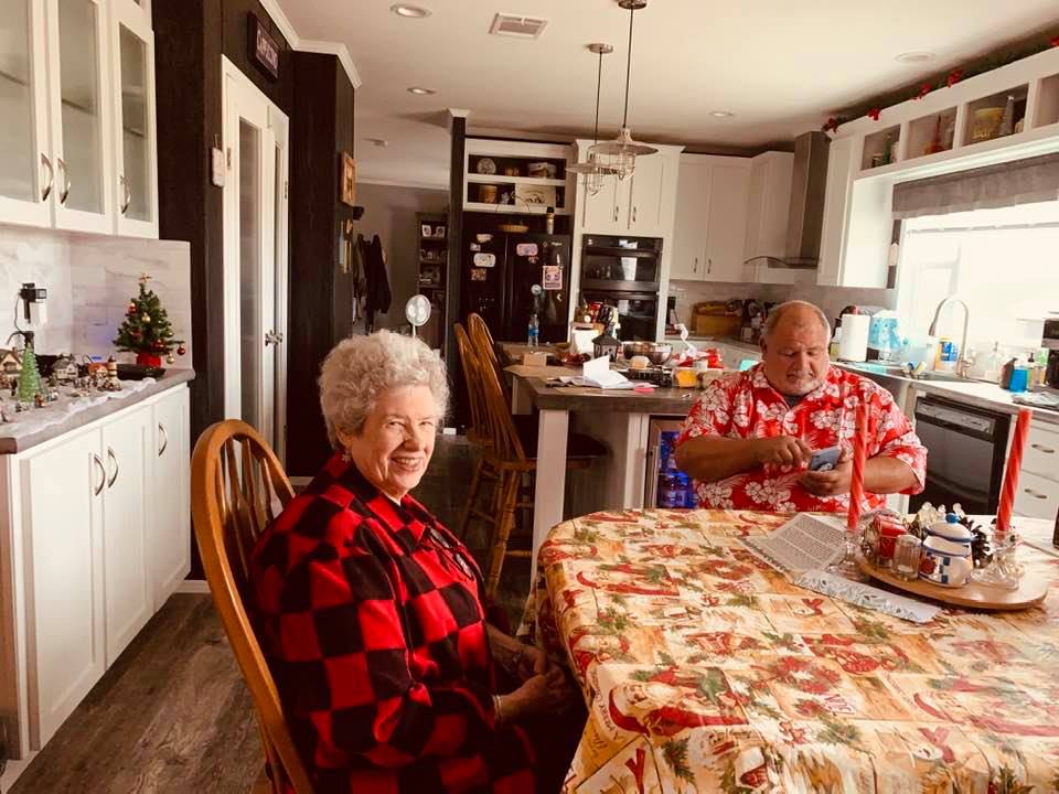 Ruth Anne and David with my kitchen in the background. Christmas ideas on the buffet and on the table. They were on the island but the grandkids tore them apart.