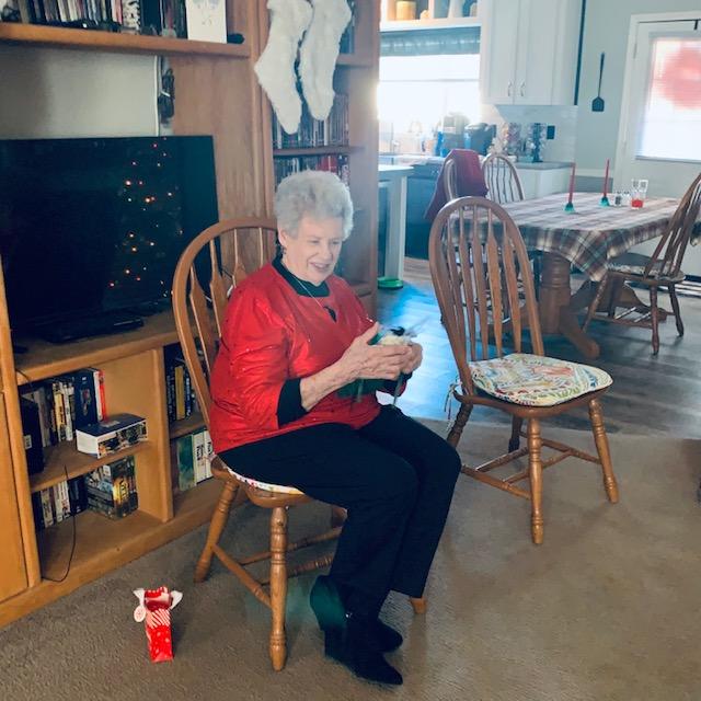 Our friend, Ruth Anne, opening a gift after a magnificent lunch.