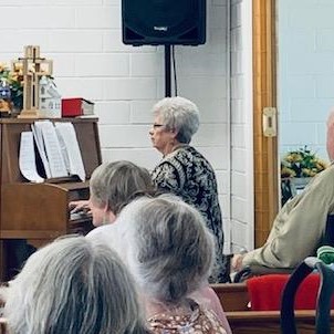 Ruth Anne playing the piano at Sand Branch Baptist Church this evening.