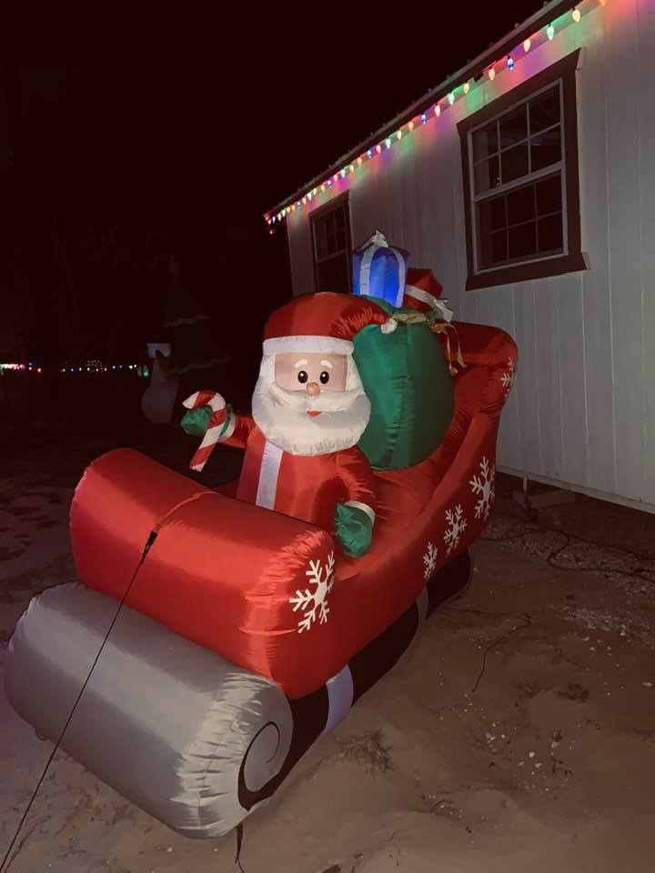 Guess who is coming tonight? This Santa is sitting outside of our business right on FM 2504.