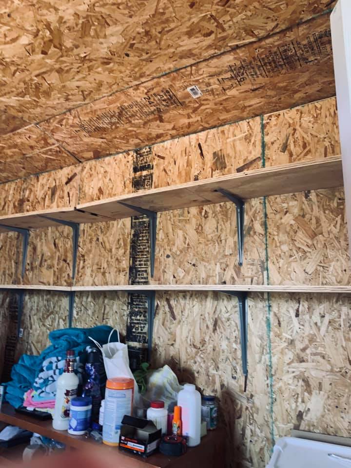 Shelves are being put in the shed so we can get some things off of the floor since we are going to be there for so long.