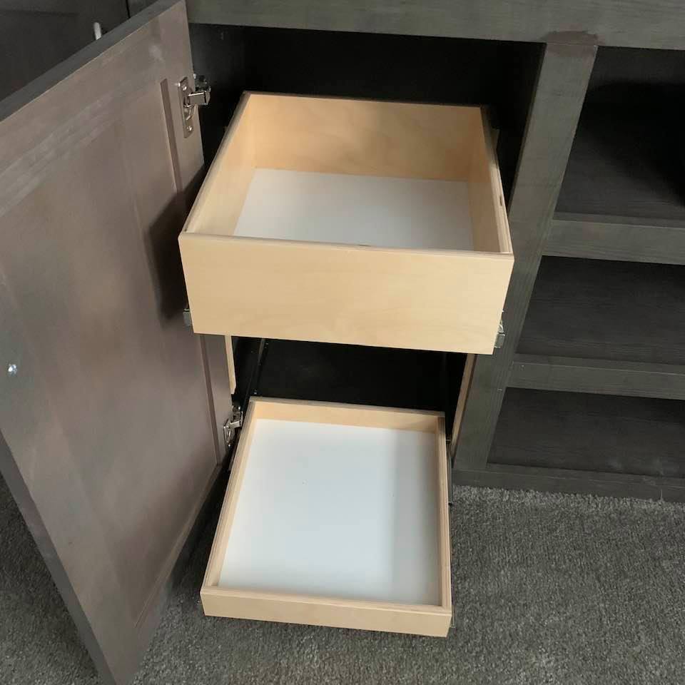 Two shelves that pull out were placed in this cabinet.