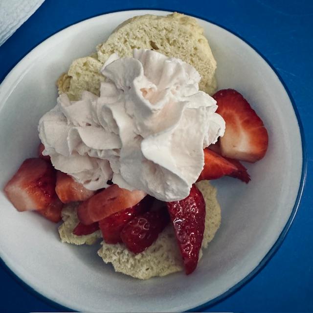 Homemade strawberry shortcake and whipped cream.