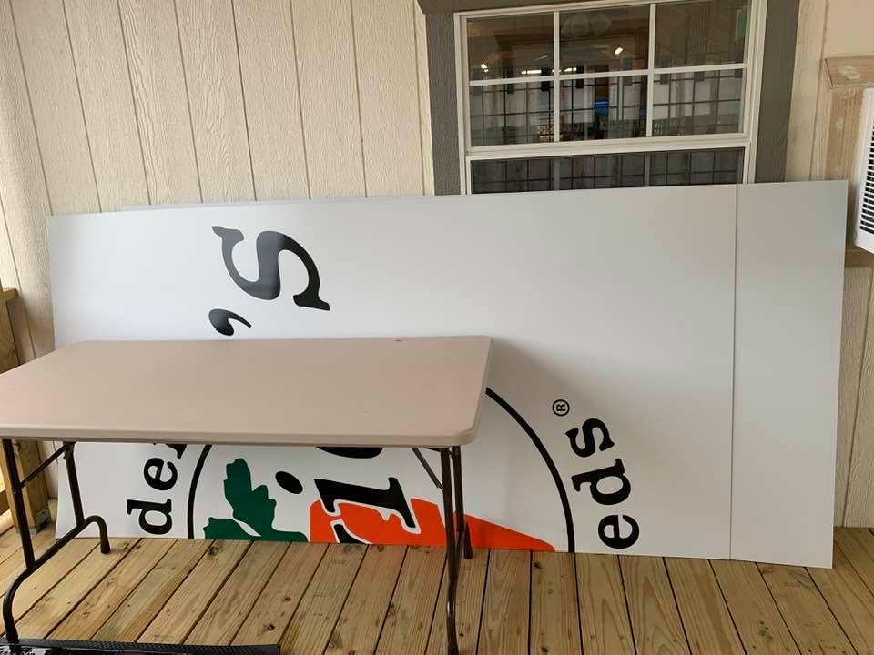 Here are the 2 sign halves that still have not been hung on the roof. They are just gathering sand sitting outside. We can't get anyone to hang the sign. Here are the 2 sign halves that still have not been hung on the roof. They are just gathering sand sitting outside. We can't get anyone to hang the sign.