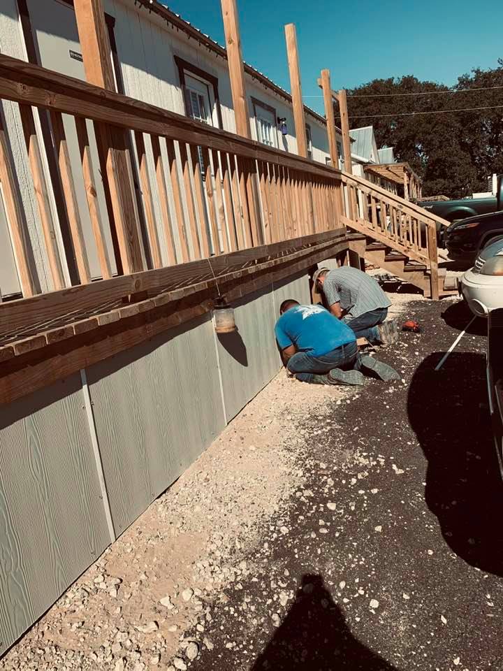 Nacho and crew skirted the newest building and then painted it to match the building. It looks great. It houses restrooms, employee breakroom, commercial kitchen, and David's office.