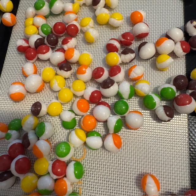 The dried Skittles look like marbles. They are crunchy and fun.