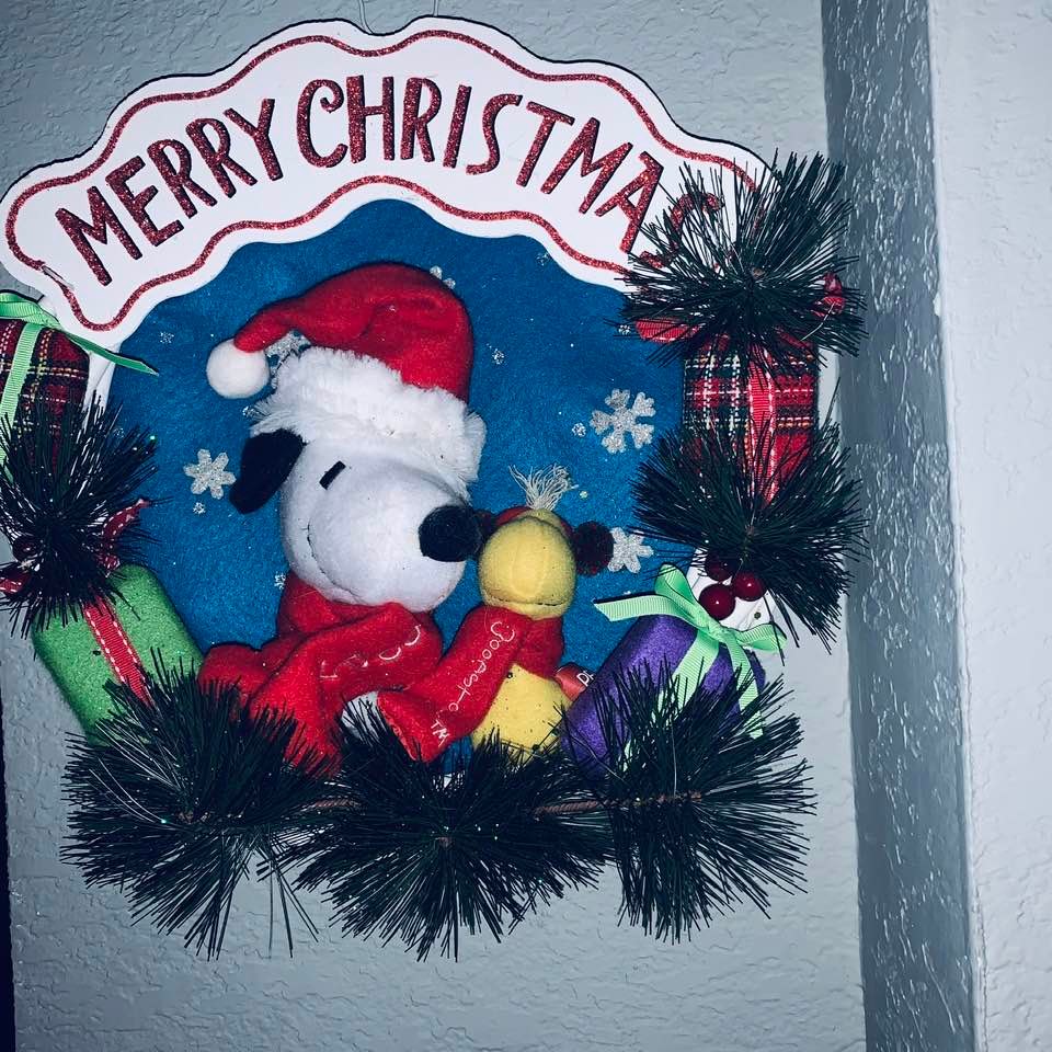 This Snoopy and Woodstock wreath was bought about four years ago for the front door. Now it is hanging in our living room this year. This Snoopy and Woodstock wreath was bought about four years ago for the front door. Now it is hanging in our living room this year.