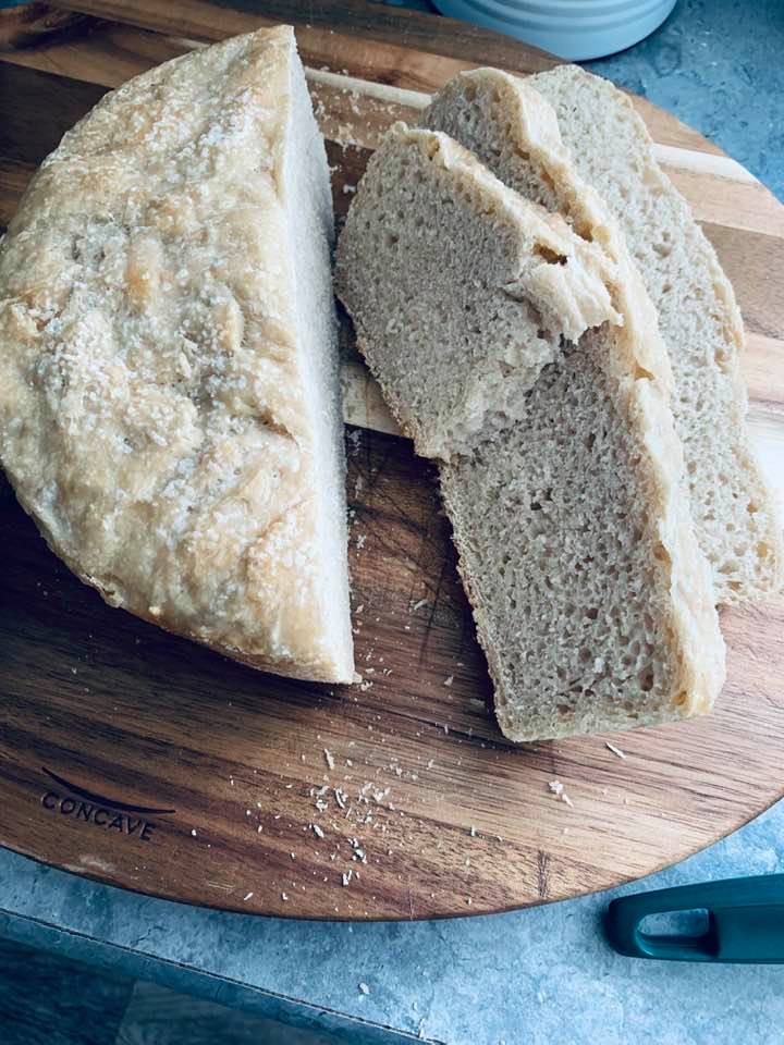 My loaf of sourdough bread that I finally baked this morning. I forgot to take a photo before cutting it. :)