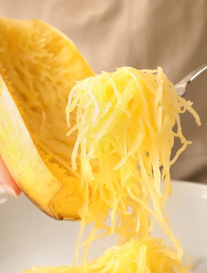 This is spaghetti squash. Yes, there are strands of the vegetable inside. You can cook it & add sauce with cheese for an amazing, healthy version of spaghetti.