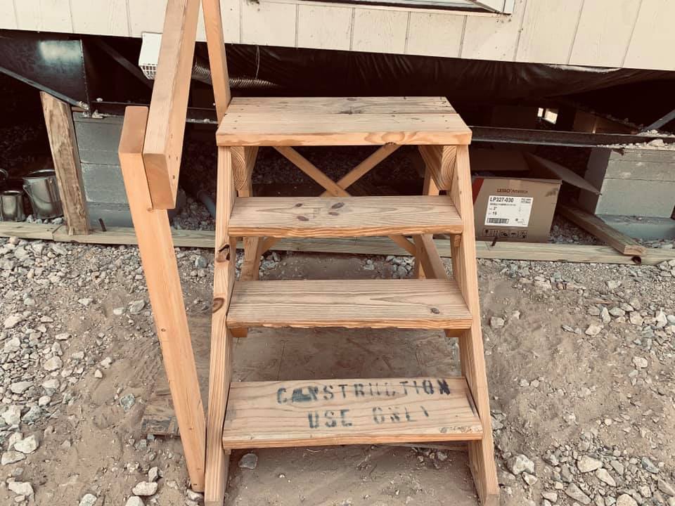 This rickety set of construction use only steps is what Palm Harbor provided for us to get in and out of our home. It is too low and very cheap. This rickety set of construction use only steps is what Palm Harbor provided for us to get in and out of our home. It is too low and very cheap.