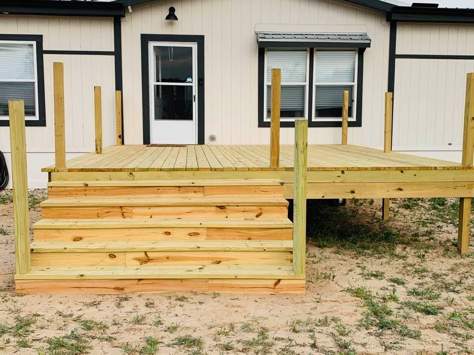 We finally got a deck and real stairs on our home instead of that awful, falling apart set of construction stairs that Palm Harbor saw fit to give us. We finally got a deck and real stairs on our home instead of that awful, falling apart set of construction stairs that Palm Harbor saw fit to give us.