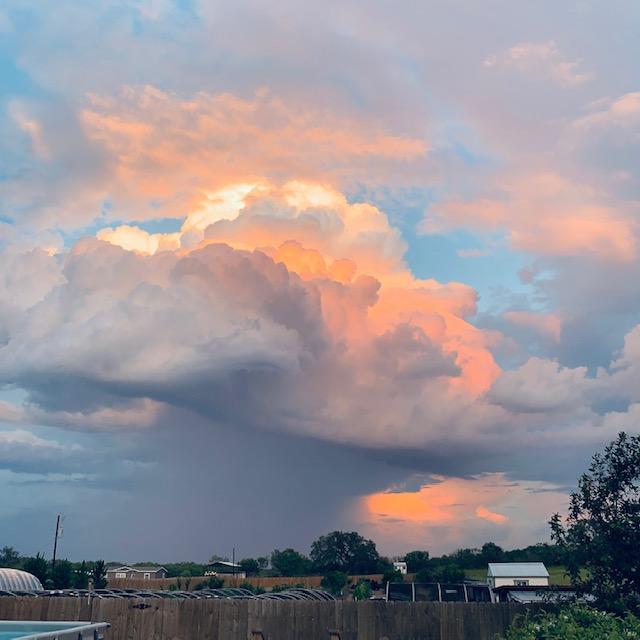 Isn't this photo gorgeous? I love the way the sun is bouncing off of the clouds. Eventually, we did get rain.