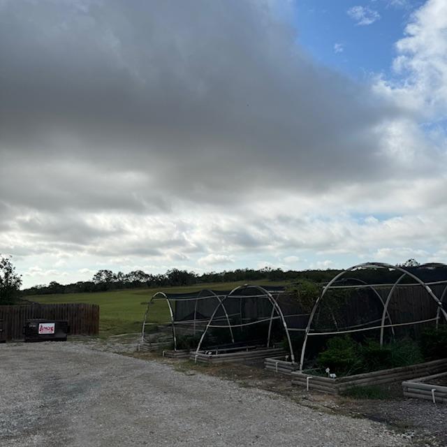 Storm clouds this morning over our new property.