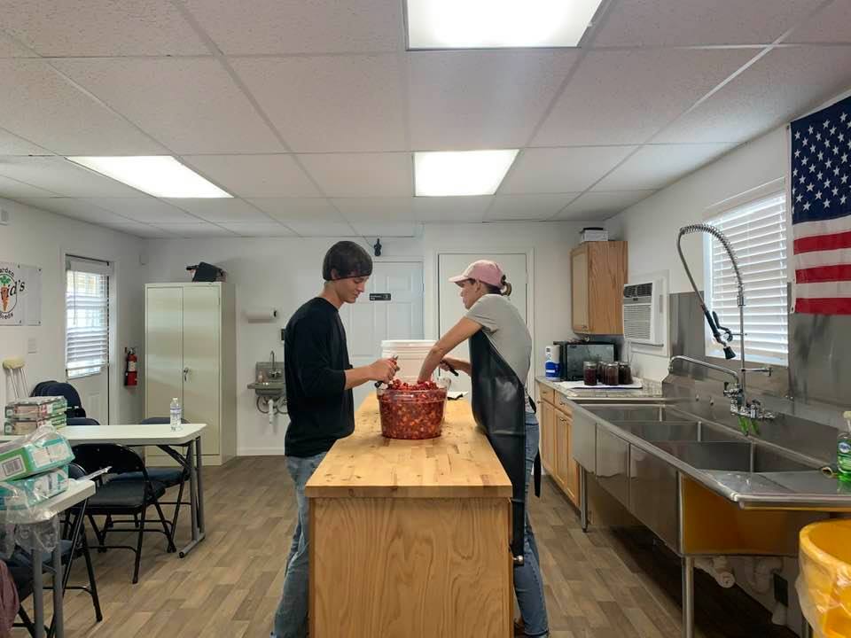 Stephen and Dalaina cut up strawberries from two local farms in our area this morning.