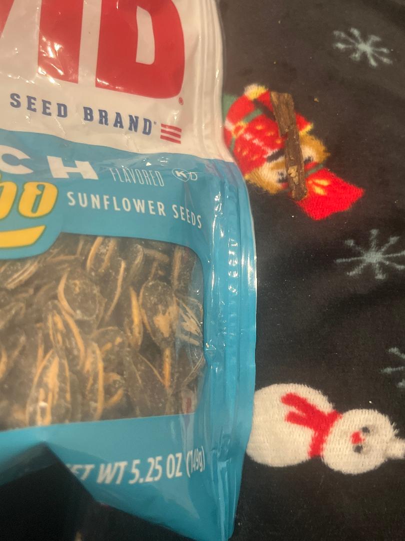 Photo showing stick, a bag of David Seeds, and the sunflowers. Clearly, this is not our company.