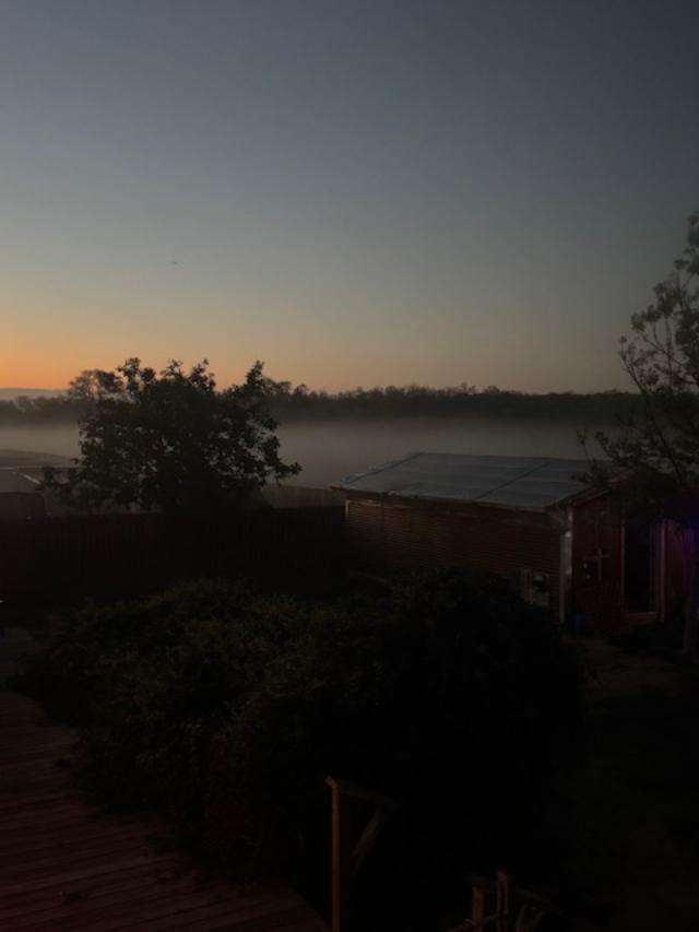 You can see bands of fog as the sun begins to come up this morning.