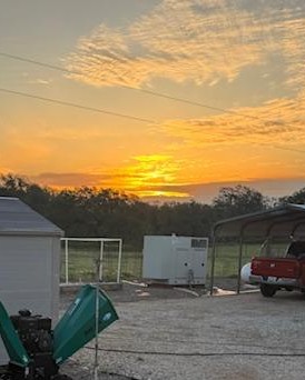 I was outside for sunrise in the front yard. You can see our wood chipper, generator, and the well house. I was outside for sunrise in the front yard. You can see our wood chipper, generator, and the well house.