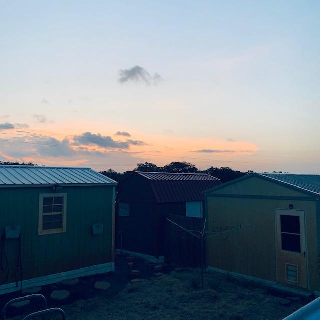 Sunrise at our first 3 sheds. The green shed is where we lived for about six weeks in August/September, 100° plus every day.