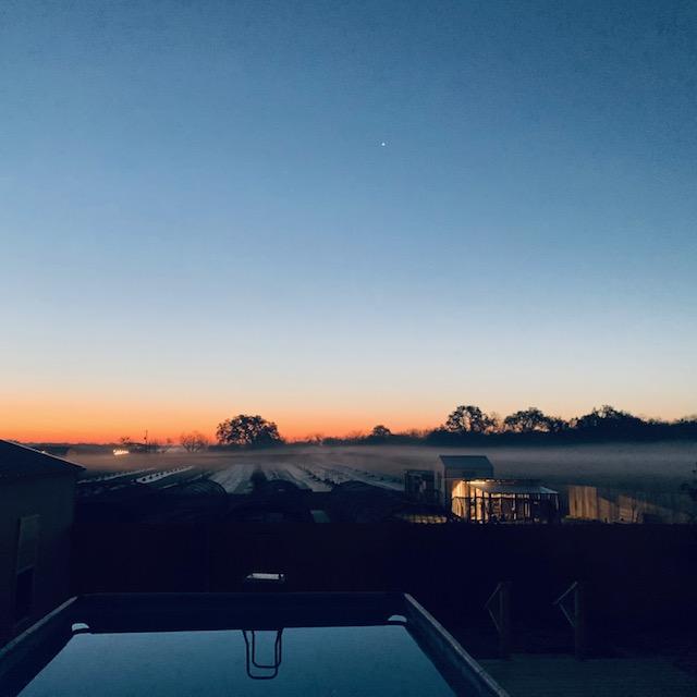 The sun will be up soon. Look at the band of fog this morning. We do have a gorgeous view.