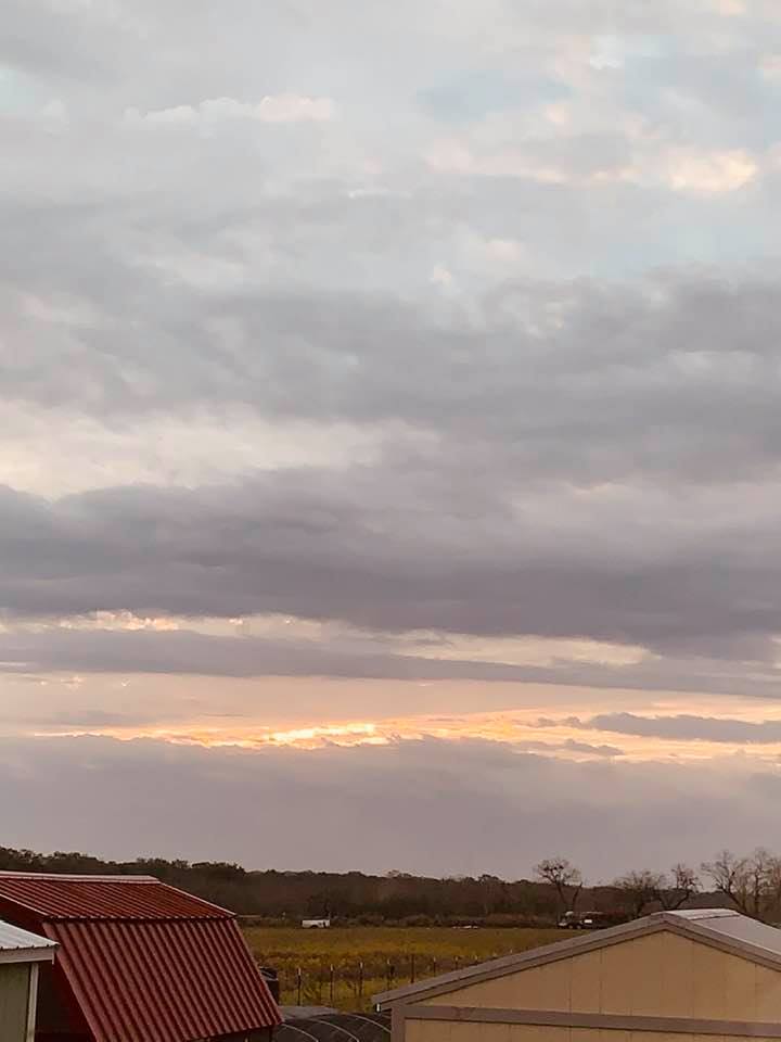 The sun shone through the clouds early this morning.