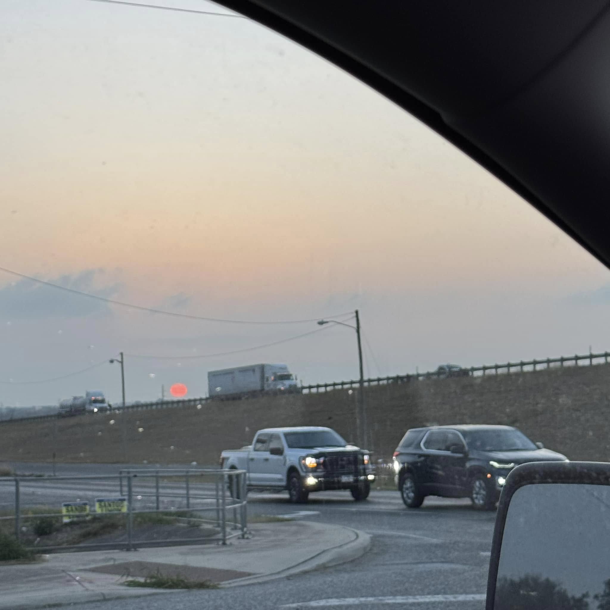 Look at that pink sun setting over I35 tonight!