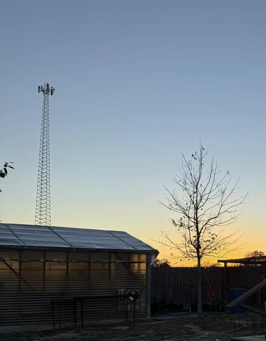 The sun is going down over my greenhouse. Another day is done.