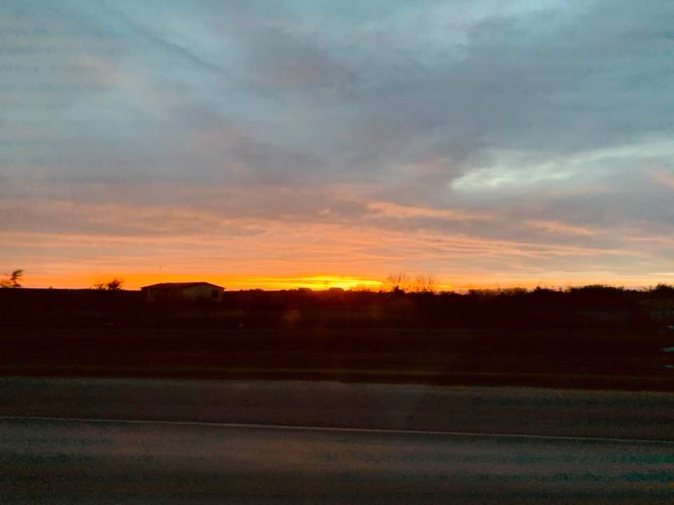 We were on our way home from the Strawberry Farm when I snapped this shot of the sun setting.