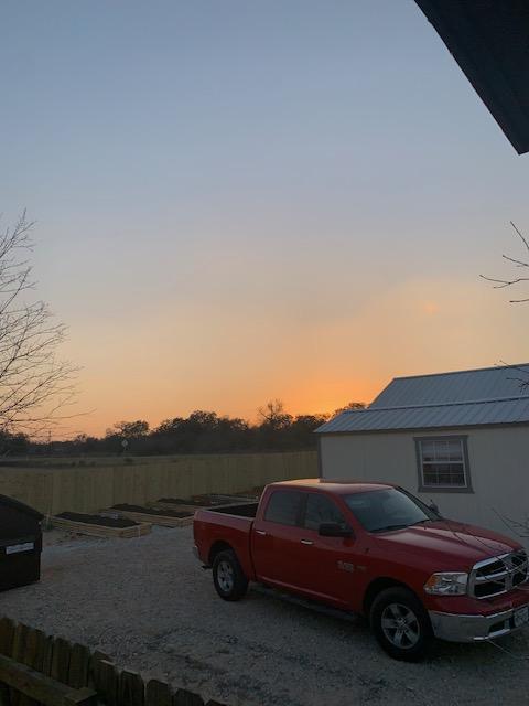 Sunset with our truck in the driveway.