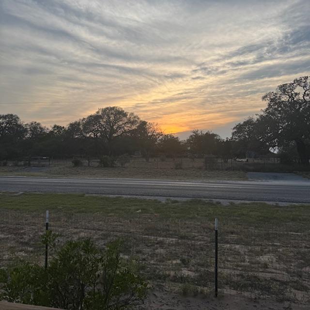 I caught the sun going down right across the road from us. I took this on the porch by the Farm Store.