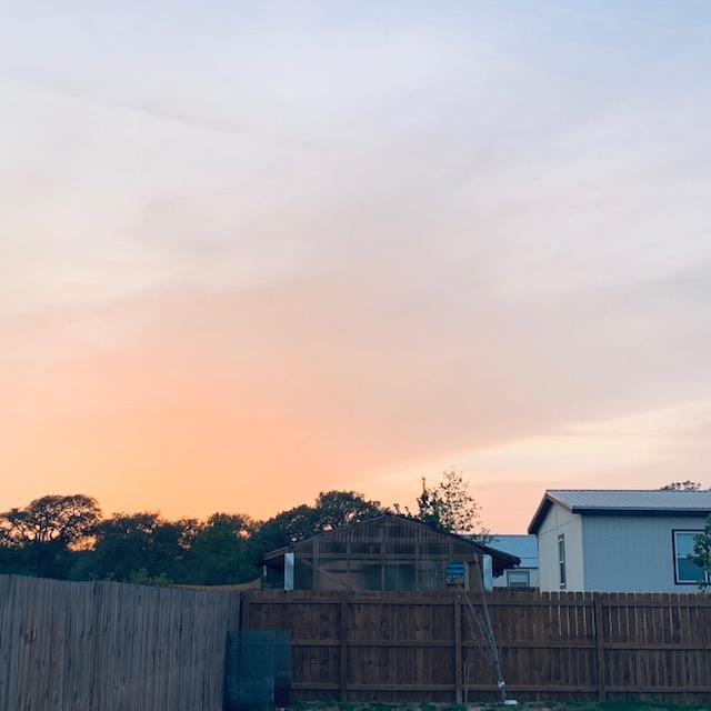 Sunset showing my greenhouse on the left and part of our home on the right as well as the Production Building a bit further out as we begin our fourth year.