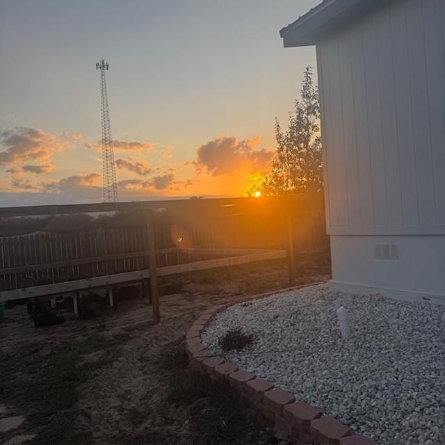 The sun is about to set from the backyard as I go out to see the goats.