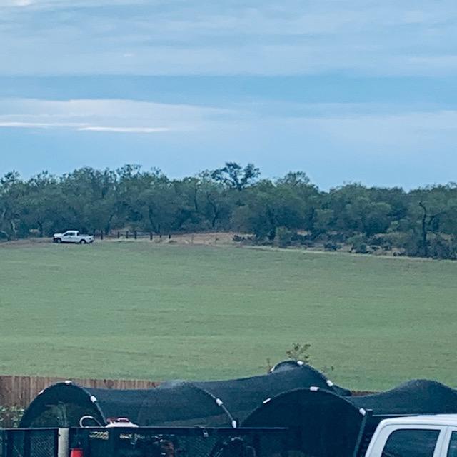 The white truck at the top of the hill belongs to the surveyor who was hired by the neighbor who owns that property. So why was he over on the other side earlier?