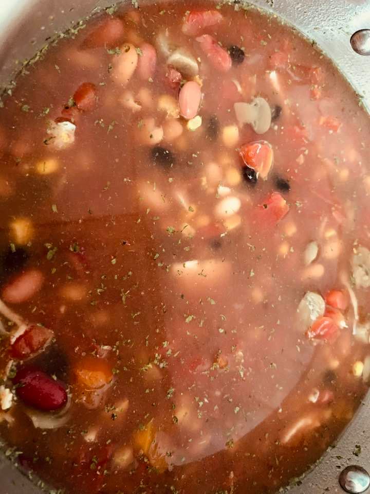 Taco soup stirred together in pot. Now it has to simmer to mix all of the flavors.