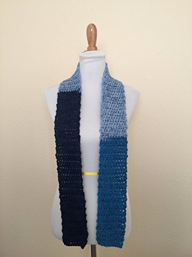 This is a crochet scarf that I call the thin blue scarf. I crocheted it using the half double crochet stitch. I made it out of part of a Caron Cake yarn.