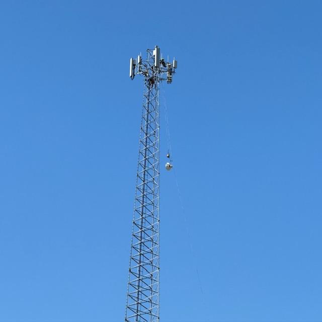 They are pulling up a dish to put on the tower this morning.