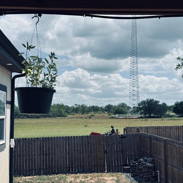 Tractor cutting field we bought.