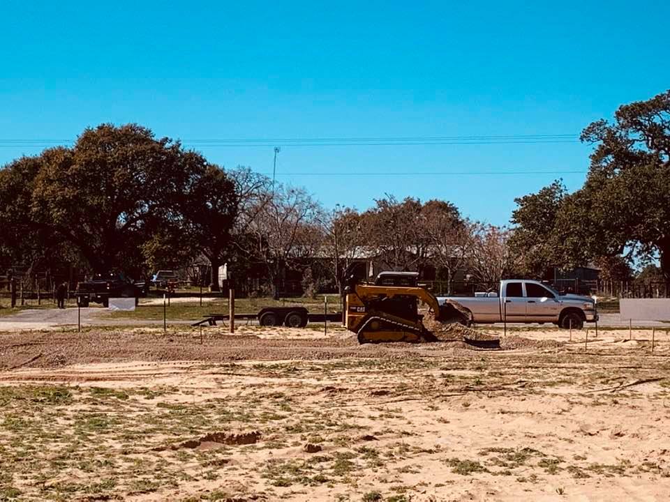 The tractor showed up and made a pad for our store building so we can sell our garden seeds out here.