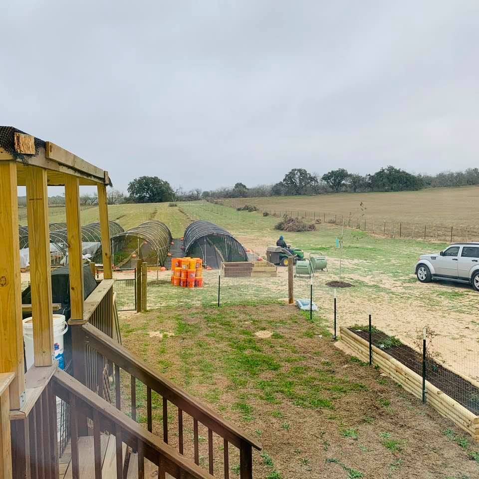 Life on the farm means working in the cold and in the heat. Here the tractor is going toward the upper fence line this morning to clear more of it.