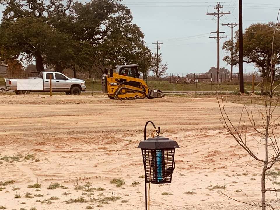 They're here! They are finally finishing up the parking lot and garden shop pad.