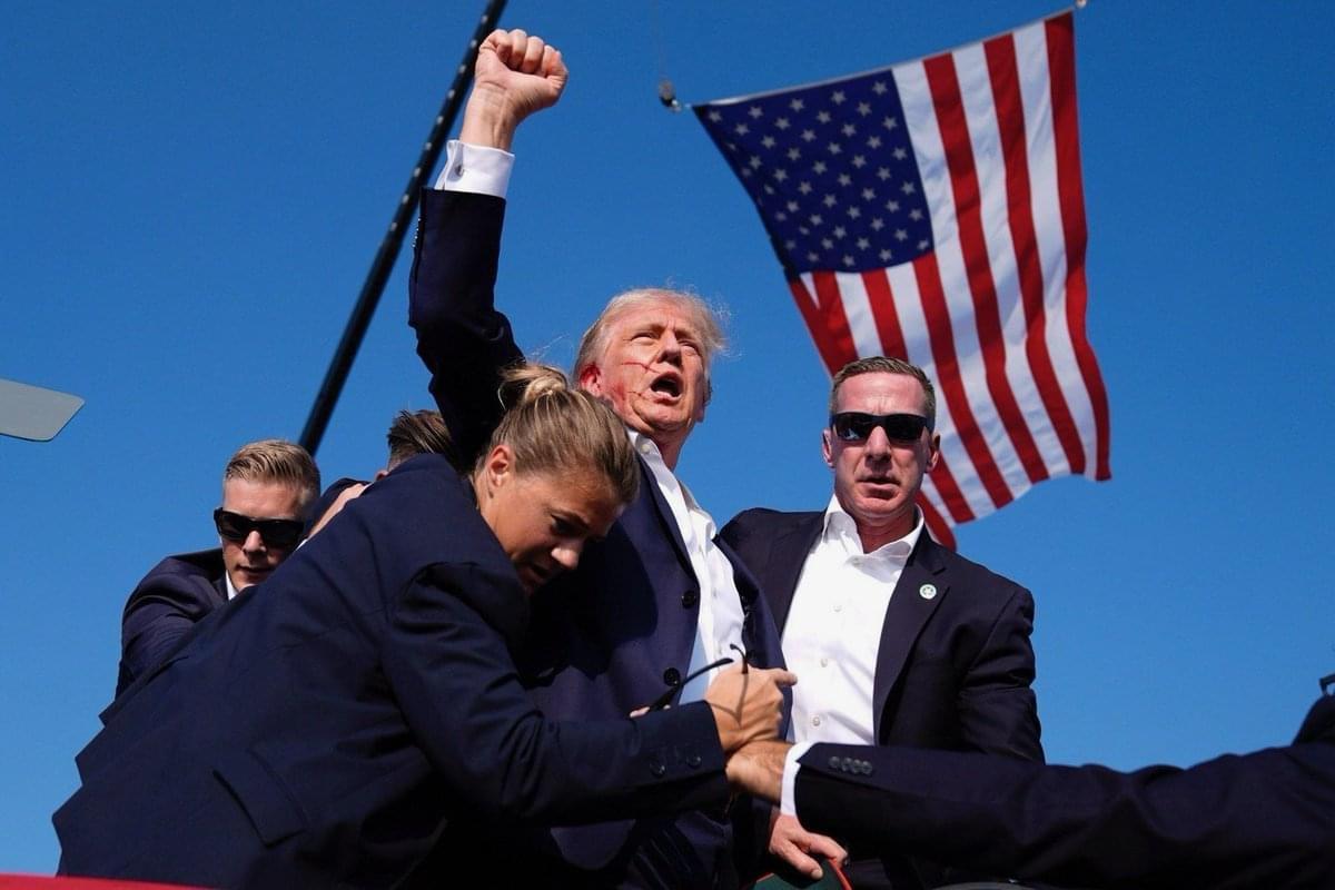 President Trump raises a defiant fist after an assassination attempt in PA. All glory goes to God. The Secret Service really messed up.