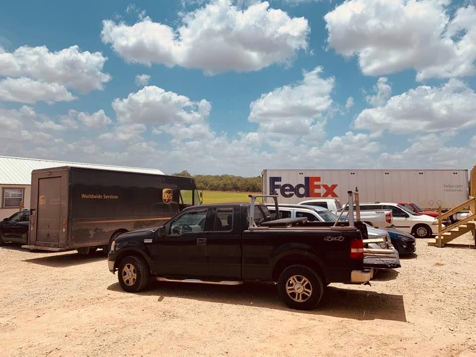 A second FedEx truck came and got stuck in the sand on the other side of the driveway. UPS came in right behind him before he was stuck.
