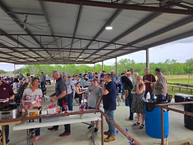 Matt and I are front and center in this photo from the picnic. The food sure was good. The meats were grilled right there in the church yard.
