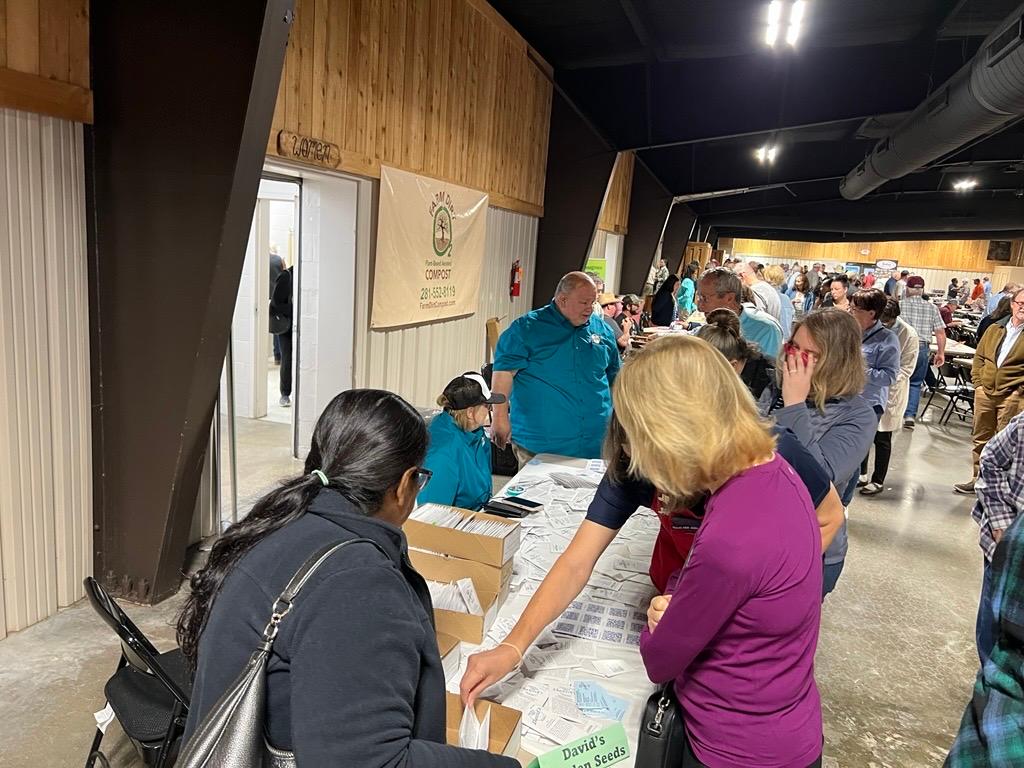 We are at our table of seeds and you can see the people lining up for something.