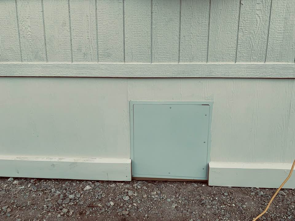 Vent door in the skirting, part of living in a mobile home. It is way too small to get into.
